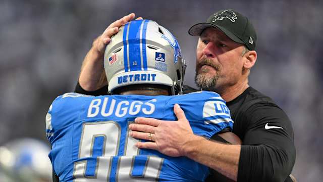 Detroit Lions coach Dan Campbell embraces defensive tackle Isaiah Buggs.